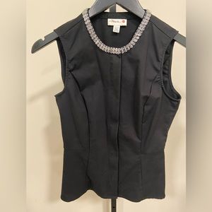 XS black peplum top. Perfect for wearing to the office.